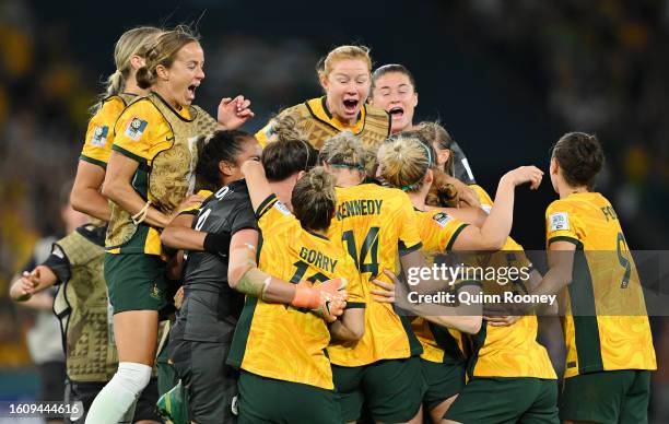 Players of Australia celebrate their side's victory in the penalty shoot out after Cortnee Vine of Australia scores her team's tenth penalty in the...