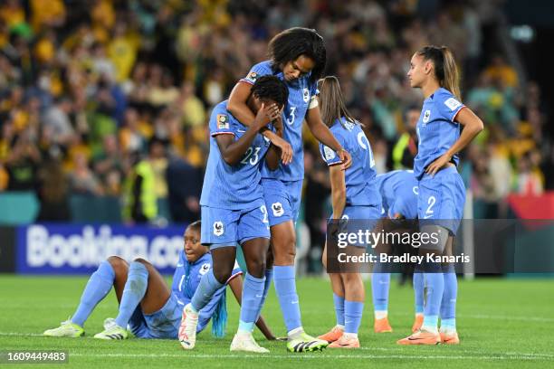 Vicki Becho of France is consoled by her teammate Wendie Renard after the team's defeat through the penalty shoot out following the FIFA Women's...
