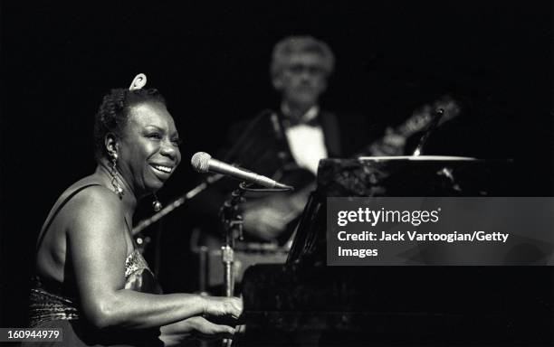 American musician and Civil Rights activist Nina Simone performs at the Beacon Theater, New York, New York, May 1, 1993. Guitarist Al Shackman is...