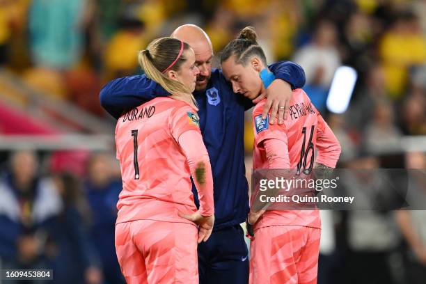 Solene Durand and Pauline Peyraud-Magnin of France are consoled after the team's defeat through the penalty shoot out following the FIFA Women's...
