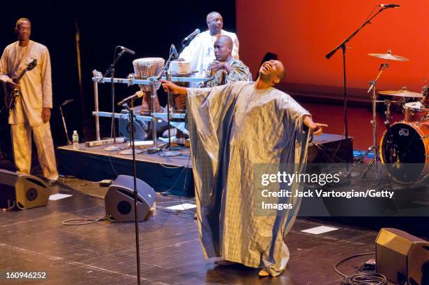 Senegalese musician Youssou N'Dour performs with his band, Super Etoile de Dakar, in the first concert of the ten-day citywide 'Muslim Voices: Arts &...