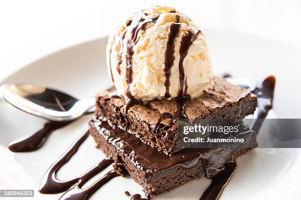 brownie with vanilla ice cream - brownie cake stock pictures, royalty-free photos & images