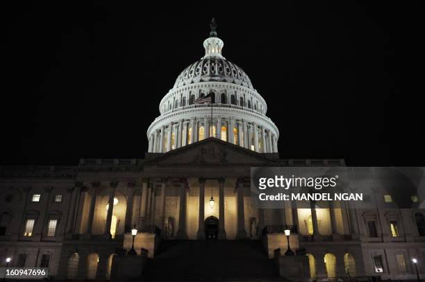The dome of the Capitol is lit up October 1, 2008 as the Senate was set to vote on a 700-billion-dollar bailout package in Washington, DC. The US...