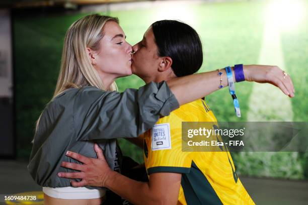 Sam Kerr of Australia celebrates with her partner Kristie Mewis of USA after her team's victory through the penalty shoot out in the FIFA Women's...