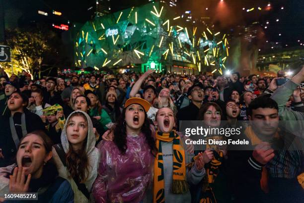 Fans at Melbourne's Federation Square cheer for the Matildas' FIFA Women's World Cup Quarter Final match between Australia and France at Brisbane...