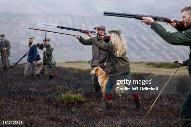 Members of a shooting party take aim as they mark the Glorious Twelfth, the annual start of the grouse shooting season on an estate in the Angus...