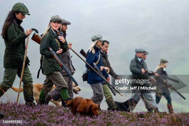 Members of a shooting party prepare to mark the Glorious Twelfth, the annual start of the grouse shooting season on an estate in the Angus Glens on...