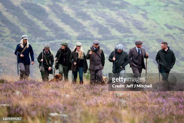 Members of a shooting party prepare to mark the Glorious Twelfth, the annual start of the grouse shooting season on an estate in the Angus Glens on...