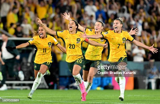 Mary Fowler, Sam Kerr, Caitlin Foord and Steph Catley of Australia celebrate the team’s victory through the penalty shoot out following the FIFA...