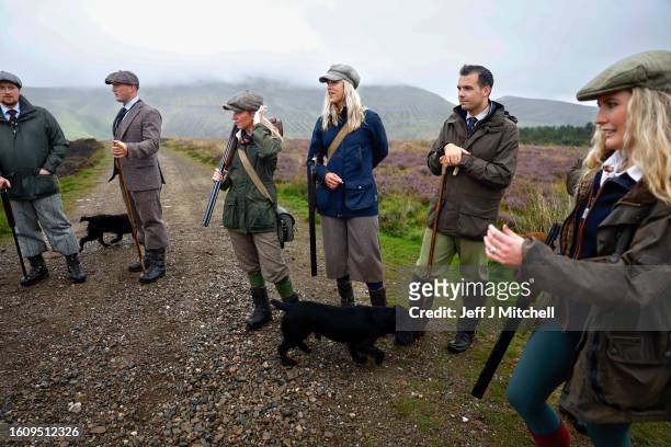 Members of a shooting party prepare to mark the Glorious Twelfth, the annual start of the grouse shooting season on an estate in the Angus Glens on...