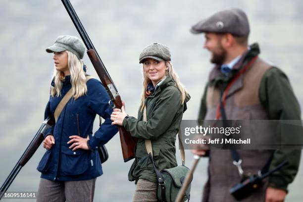 Members of a shooting party prepare to mark the Glorious Twelfth, the annual start of the grouse shooting season on an estate in the Angus Glens on...