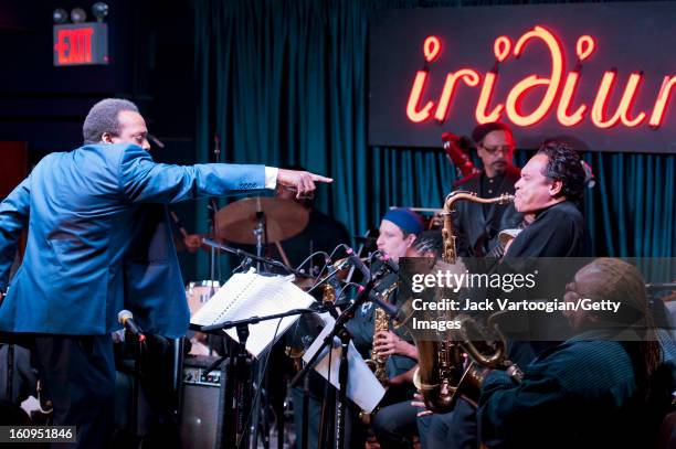 American jazz musician David Murray leads his Blues Big Band as he points at saxophonist Jay Rodriguez during a performance at Iridium, New York, New...