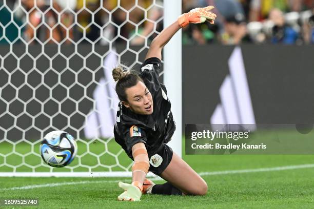 Mackenzie Arnold of Australia dives as Vicki Becho of France misses her team's tenth penalty in the penalty shoot out during the FIFA Women's World...