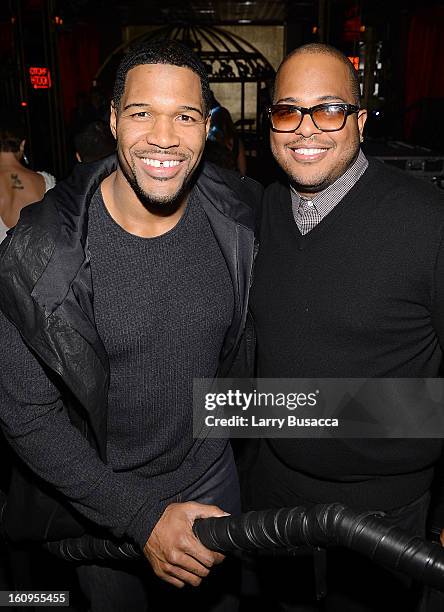 Former NFL player Michael Strahan and President of A&R at Epic Records Tricky Stewart attend the Pre-Grammy Showcase For Epic Records Recording...