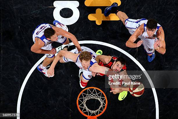 Luke Schenscher of the 36ers and Jeremiah Trueman of the Wildcats contest for a rebound during the round 18 NBL match between the Perth Wildcats and...