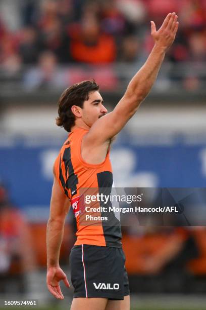 Toby Bedford of the Giants celebrates a goal during the 2023 AFL Round 23 match between the GWS GIANTS and the Essendon Bombers at GIANTS Stadium on...
