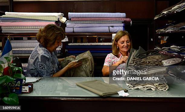 Argentine Mirta and Carmen at work in the Aux Charpentiers store and "bombachas" factory, in Buenos Aires, on November 16, 2012. The typical...