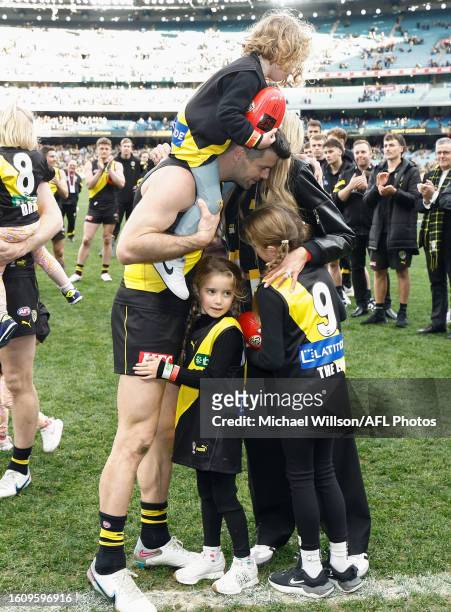 Trent Cotchin of the Tigers embraces his wife Brook and family after his final match during the 2023 AFL Round 23 match between the Richmond Tigers...
