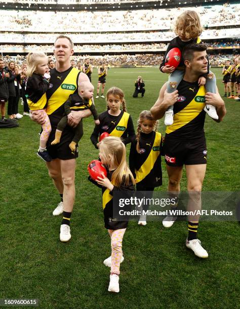 Jack Riewoldt of the Tigers and Trent Cotchin of the Tigers leave the field with their children after their final matches during the 2023 AFL Round...