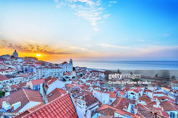 sunrise over the rooftops of alfama. lisbon - alfama lisbon stock pictures, royalty-free photos & images