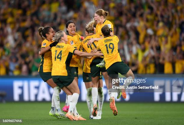 Players of Australia celebrate their side's victory in the penalty shoot out after Cortnee Vine of Australia scores her team's tenth penalty in the...