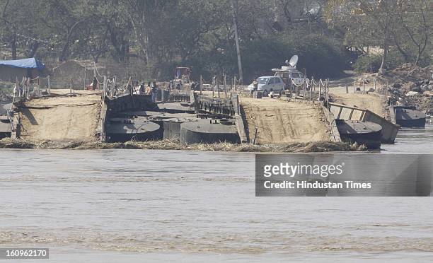 The portion of Temporary Pantoon Bridge remains as rest of the bridge was swayed away by the water released suddenly from the Hathni Kund Bairaj...