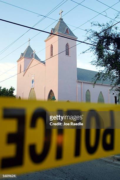 Police crime scene tape closes a street in front of the church being used for a memorial service to honor slain fellow officers August 16, 2001 in...
