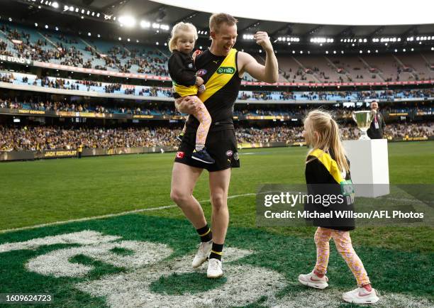 Jack Riewoldt of the Tigers completes a lap of honour with his daughters after his final match during the 2023 AFL Round 23 match between the...