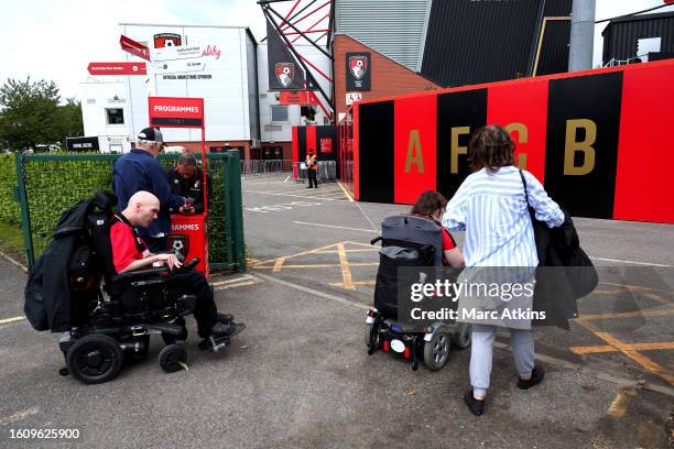 General view as fans of AFC Bournemouth, using mobility scooters, arrive at the stadium prior to the Premier League match between AFC Bournemouth and...