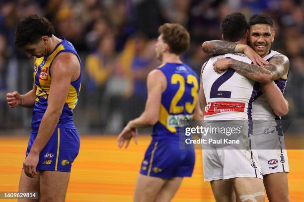 Jaeger O'Meara and Michael Walters of the Dockers celebrate a goal during the round 22 AFL match between West Coast Eagles and Fremantle Dockers at...