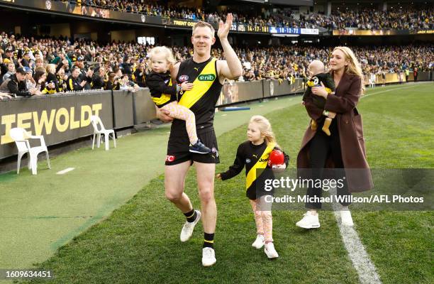 Jack Riewoldt of the Tigers completes a lap of honour with wife Carly and children after his final match during the 2023 AFL Round 23 match between...