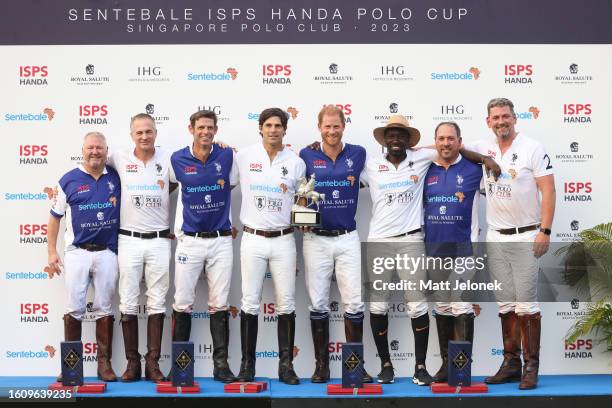 Prince Harry, The Duke of Sussex, and players of the Royal Salute Sentebale and Singapore Polo Club pose for a photo the prize giving presentation at...