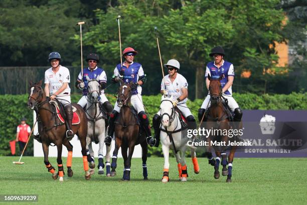 Players of the Royal Salute Sentebale and Singapore Polo Club play polo during the Sentebale ISPS Handa Polo Cup on August 12, 2023 in Singapore. The...