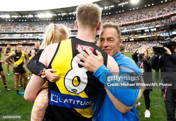 Jack Riewoldt of the Tigers is congratulated by Alastair Clarkson, Senior Coach of the Kangaroos after his final match during the 2023 AFL Round 23...