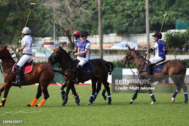 Players of the Royal Salute Sentebale and Singapore Polo Club play polo during the Sentebale ISPS Handa Polo Cup on August 12, 2023 in Singapore. The...