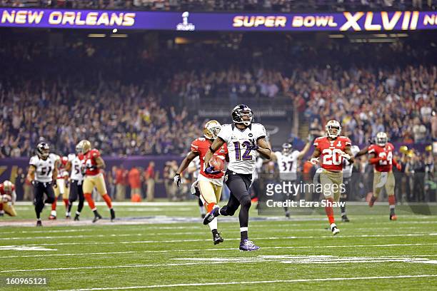 Jacoby Jones of the Baltimore Ravens returns the opening kick-off for the second half 108-yards for a touchdown against the San Francisco 49ers...