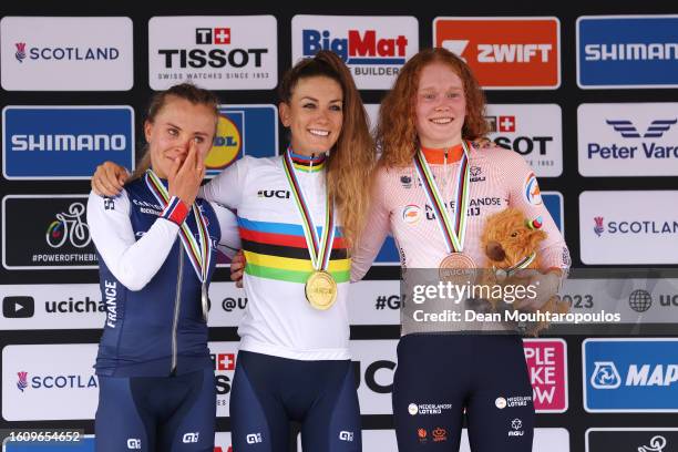 Silver medalist Loana Lecomte of France, gold medalist Pauline Ferrand Prevot of France and bronze medalist Puck Pieterse of Netherlands pose on the...