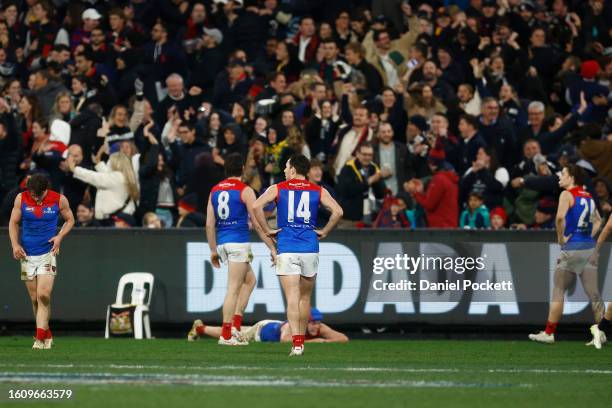 Demons players looks dejected after the round 22 AFL match between Carlton Blues and Melbourne Demons at Melbourne Cricket Ground, on August 12 in...