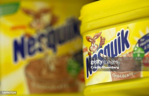 Cartons of Nesquik chocolate milk powder, produced by Nestle SA, sit on a shelf inside a supermarket in London, U.K., on Friday, Feb. 8, 2013....