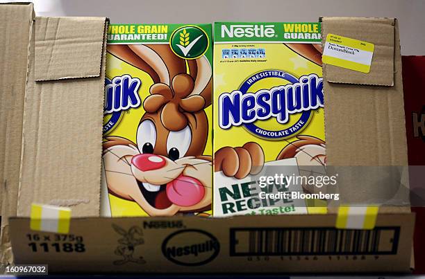 Cartons of Nesquik chocolate flavored breakfast cereal, produced by Nestle SA, sit in a box ahead of re-stocking at a supermarket in London, U.K., on...