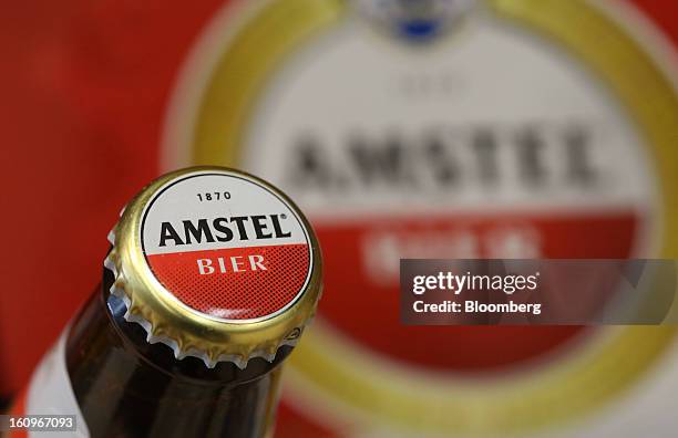 Bottle of Amstel lager beer, produced by Heineken NV, sits on display inside a supermarket in London, U.K., on Friday, Feb. 8, 2013. Britain's...