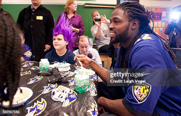 Torrey Smith shares a protein packed breakfast, including milk, with students in support of the Breakfast Blitz campaign. The initiative is a...