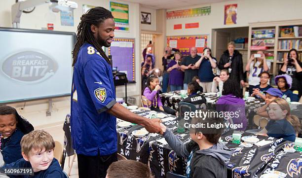 Torrey Smith shares a protein packed breakfast, including milk, with students in support of the Breakfast Blitz campaign. The initiative is a...