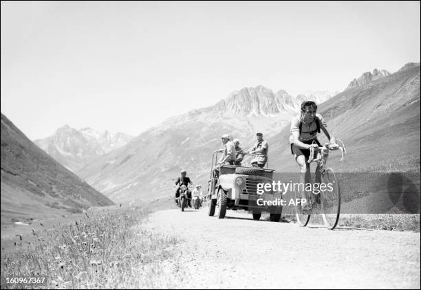 Italian cyclist Fausto Coppi rides uphill in the Col du Galibier on July 6 during the 11th stage of the Tour de France between Bourg d'Oisans and...