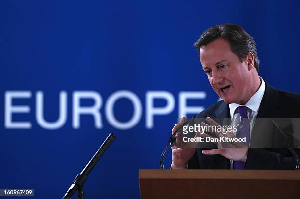 British Prime Minister David Cameron addresses the media at the headquarters of the Council after reaching a deal on the budget for 2014-20 on...