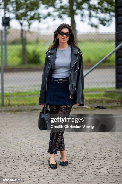 Francesca Saffari wears black leather jacket, bag, laced skirt, mini skirt outside Helmstedt during the Copenhagen Fashion Week Spring/Summer 2024 on...