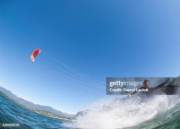 a man kiteboarding - kite surfing stock pictures, royalty-free photos & images