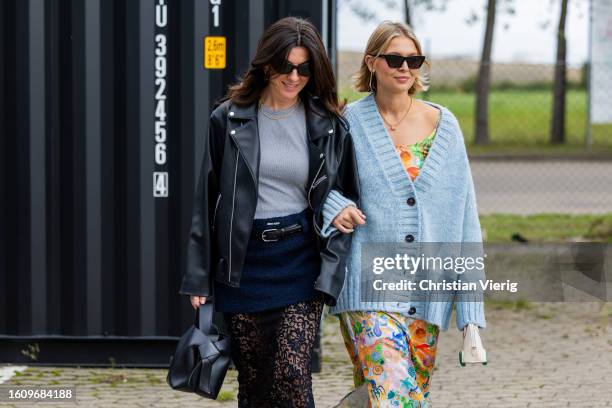 Francesca Saffari wears black leather jacket, bag, laced skirt, mini skirt & Hollie Mercedes Peters wears blue cardigan, skirt with floral print, bag...