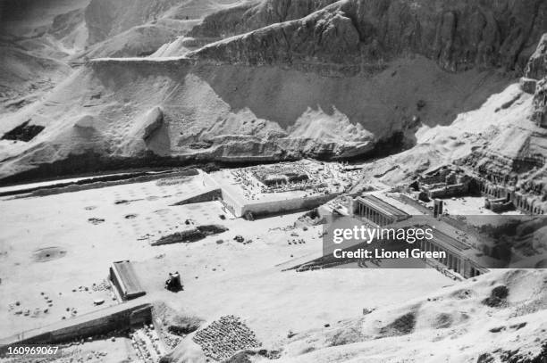 An aerial view of the ancient Egyptian mortuary temple of Queen Hatshepsut at Deir el-Bahari, Egypt, circa 1950. The temple is dedicated to the sun...