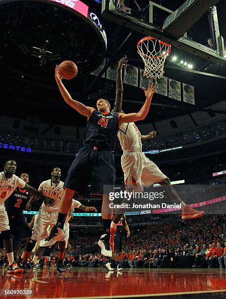 Rob Chubb of the Auburn Tigers grabs a rebound away from Noel Johnson of the Illinois Fighting Illini at United Center on December 29, 2012 in...